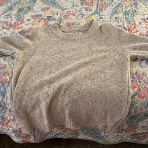 Alya large sweater has buttons on each sleeve